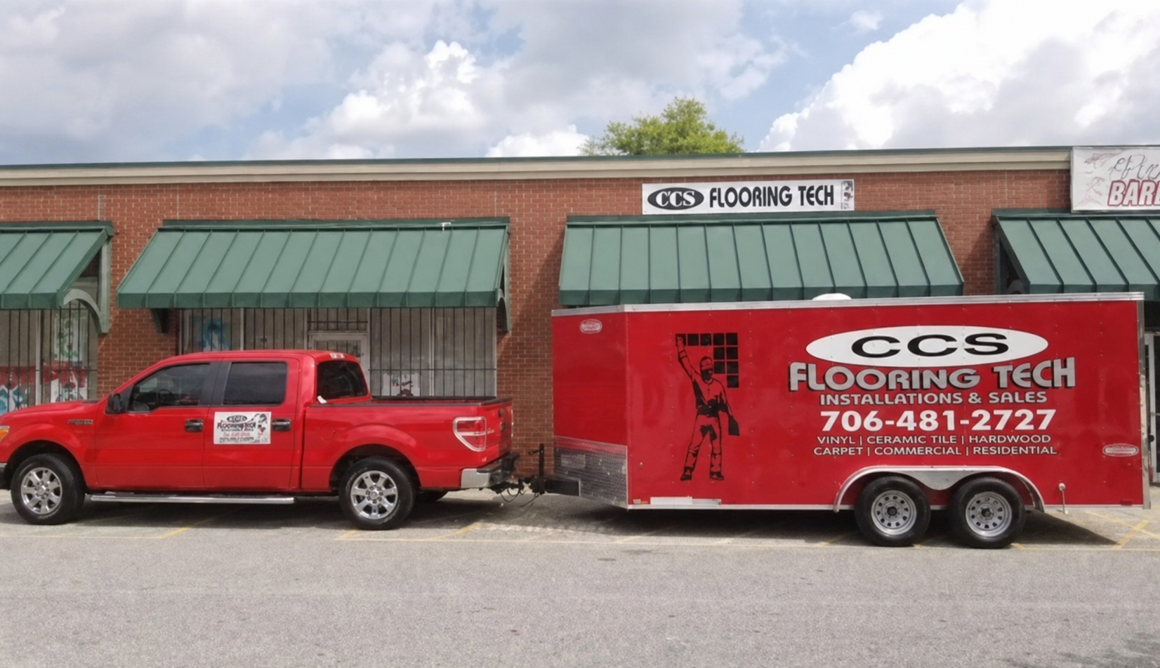 CCS Flooring Tech truck and branded trailer parked outside the company office