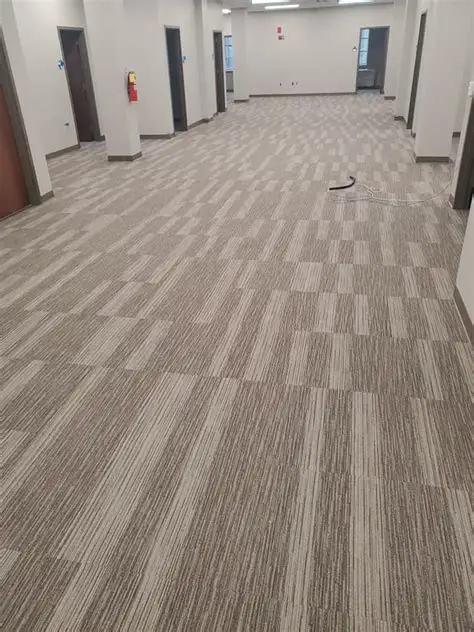 Finished carpet tile installation in a commercial corridor